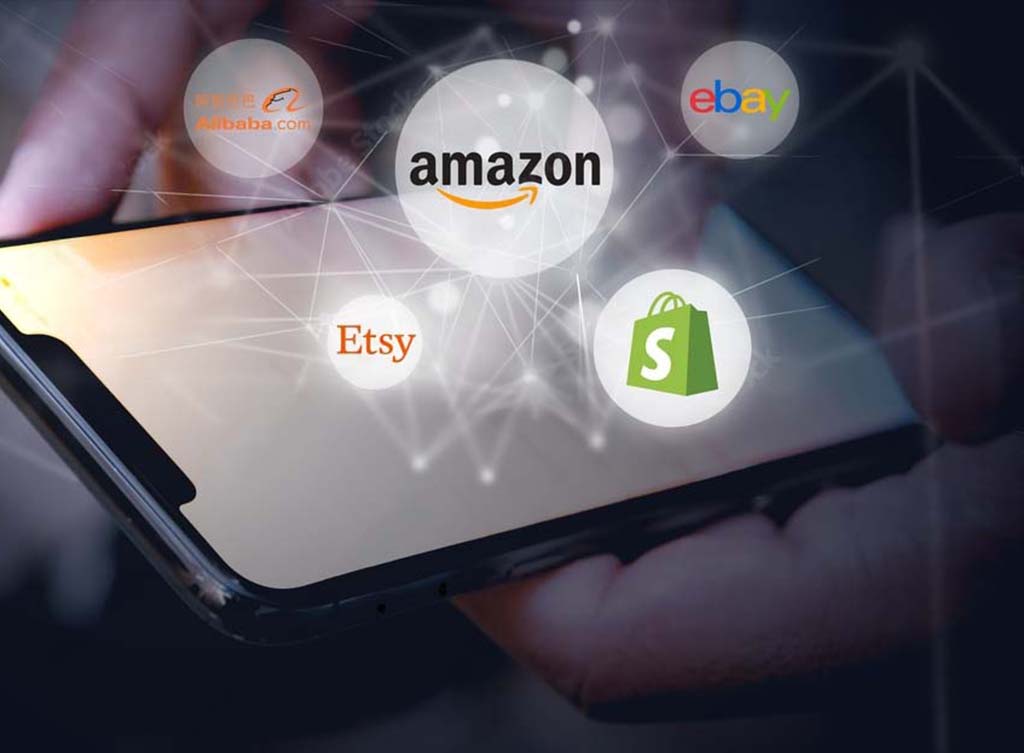 An image of someone holding a mobile device with online store platforms' logos hovering above it
